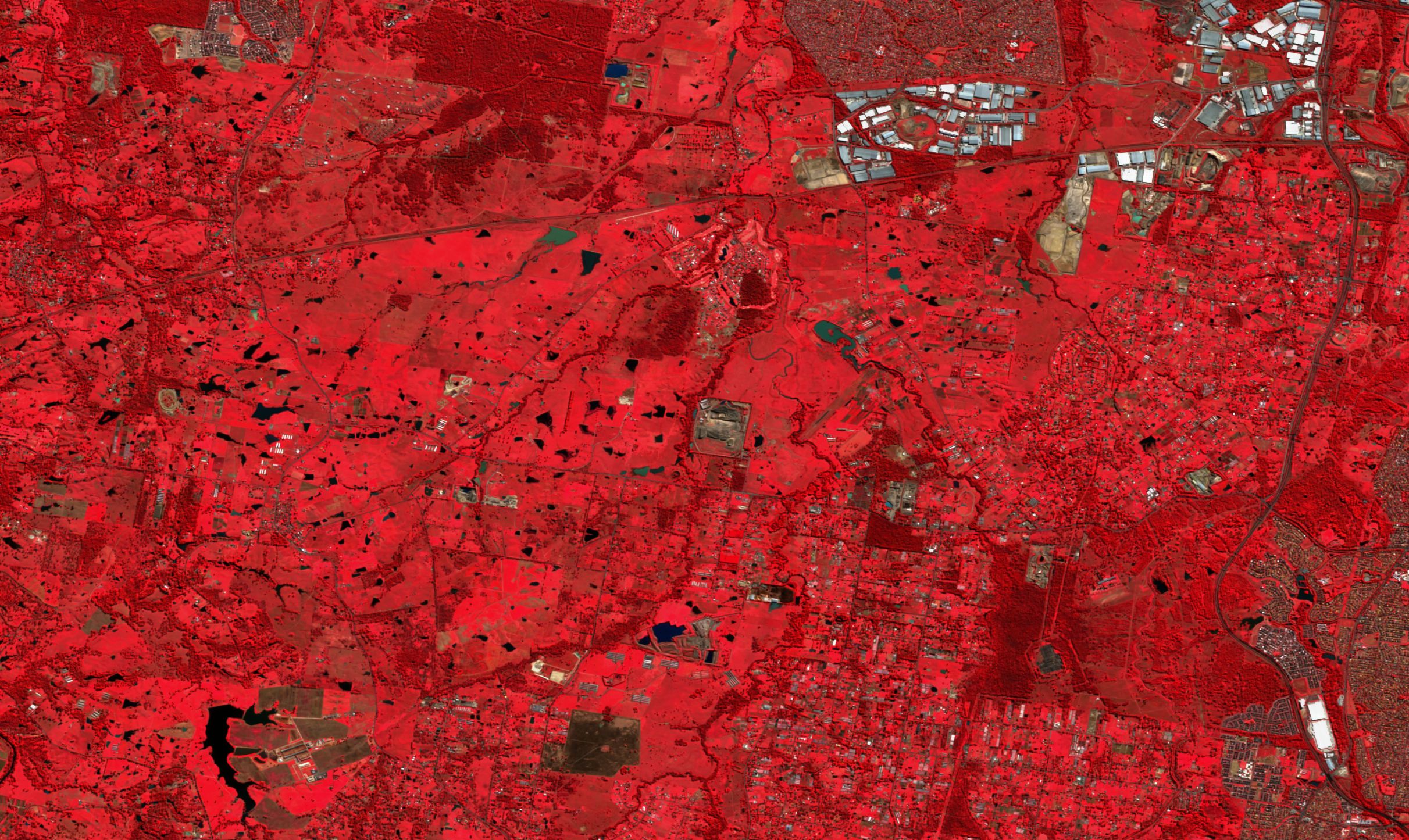 Western Sydney Airport site, Sentinel-2 false colour, June 2017: farmland and bush before construction.